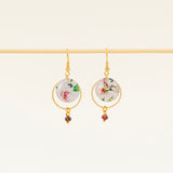 Boucles d'oreilles artisanales Adélaïde bleu - papier résiné plumes de paon et laiton doré, fait main en France
