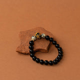 Bracelet perles Fitz Roy - onyx noir et jaspe dalmatien, perle dorée centrale, fait main en France