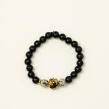 Bracelet perles Fitz Roy - onyx noir et jaspe dalmatien, perle dorée centrale, fait main en France