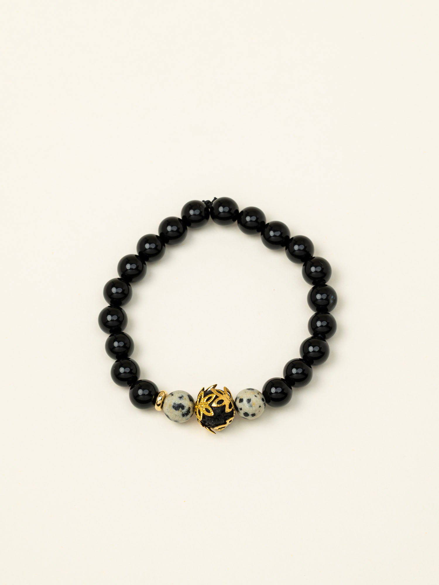 Bracelet perles Fitz Roy - onyx noir et jaspe dalmatien, perle dorée centrale, fait main en France