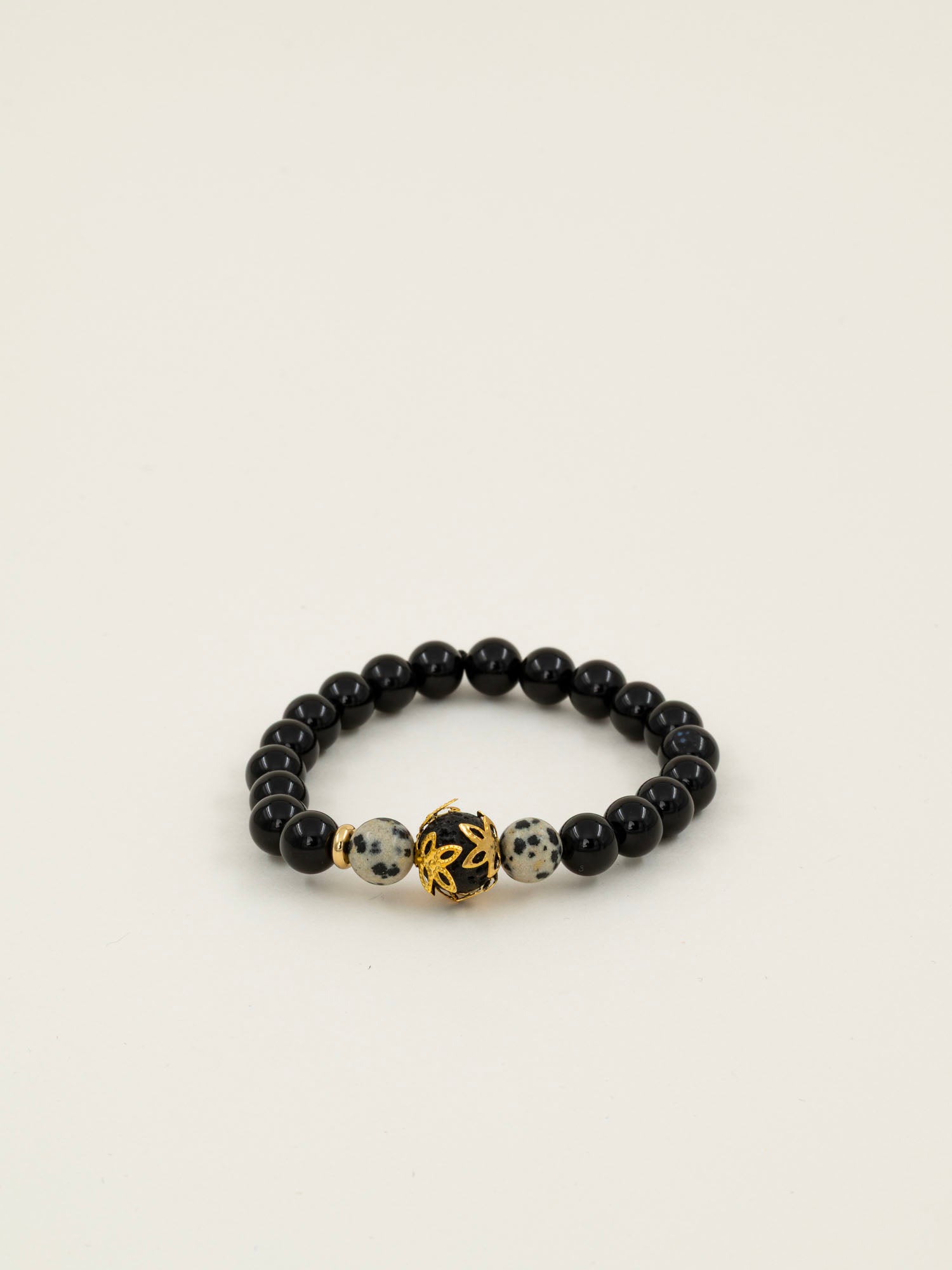 Bracelet perles Fitz Roy - onyx noir et jaspe dalmatien, perle dorée centrale, fait main en France