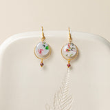 Boucles d'oreilles artisanales Adélaïde bleu - papier résiné plumes de paon et laiton doré, fait main en France